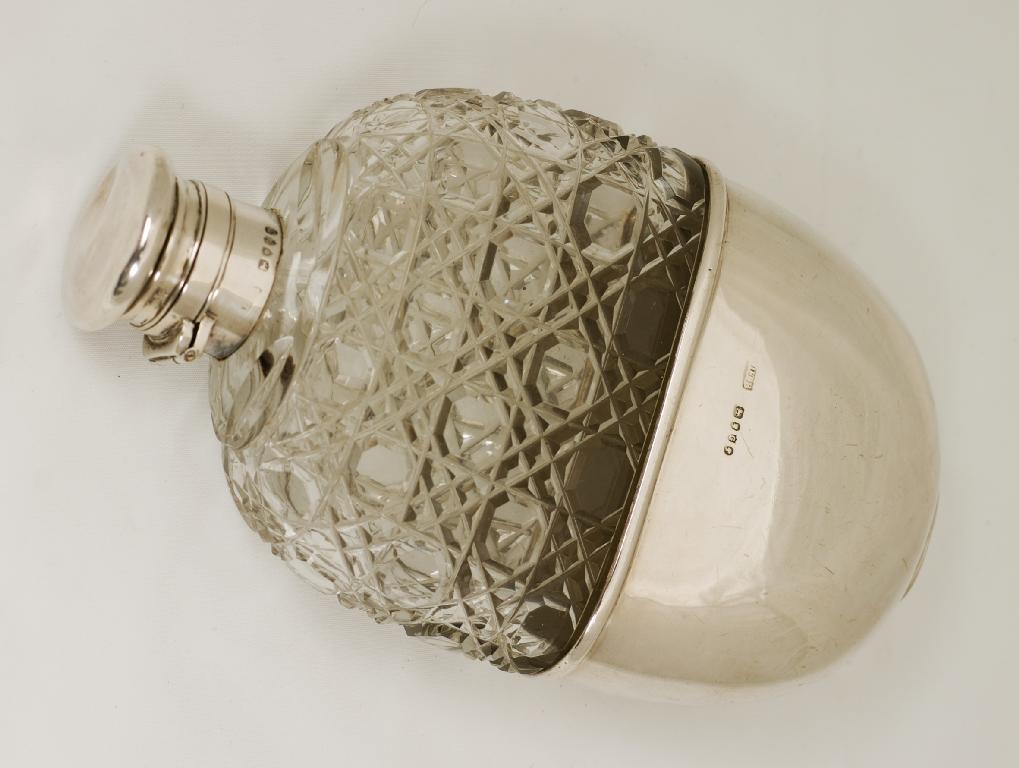 Appraisal: LARGE VICTORIAN SILVER AND CUT-GLASS HIP FLASK BIRMINGHAM of characteristic