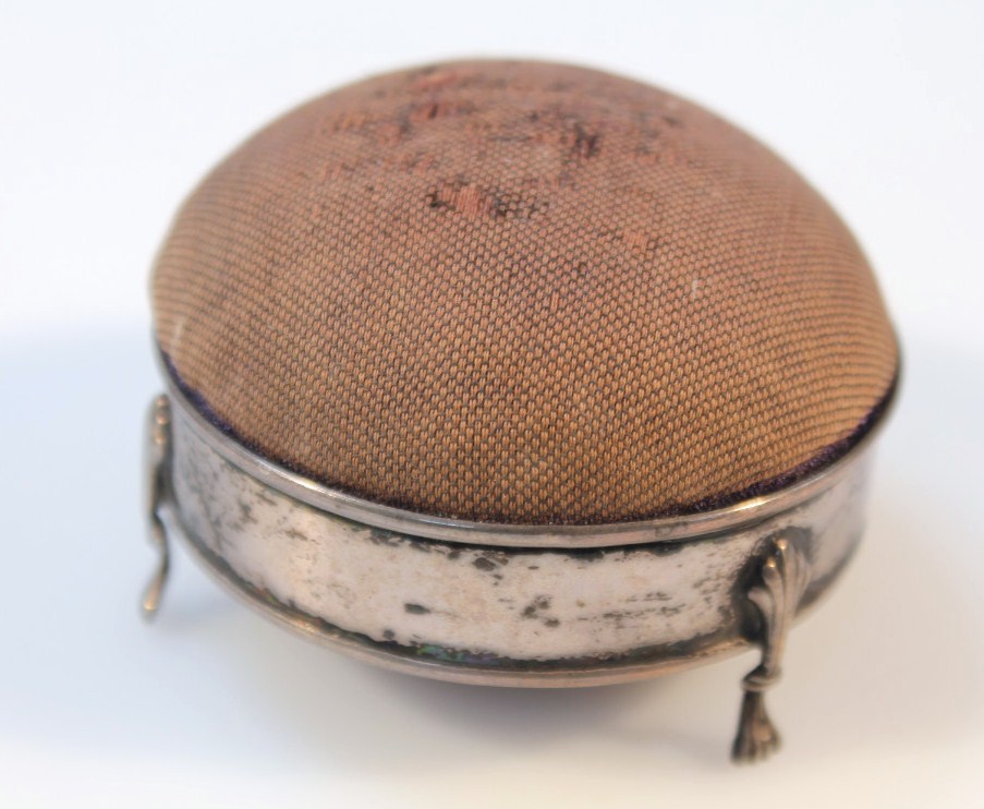 Appraisal: An Edwardian silver and material pin cushion by Deakin Francis