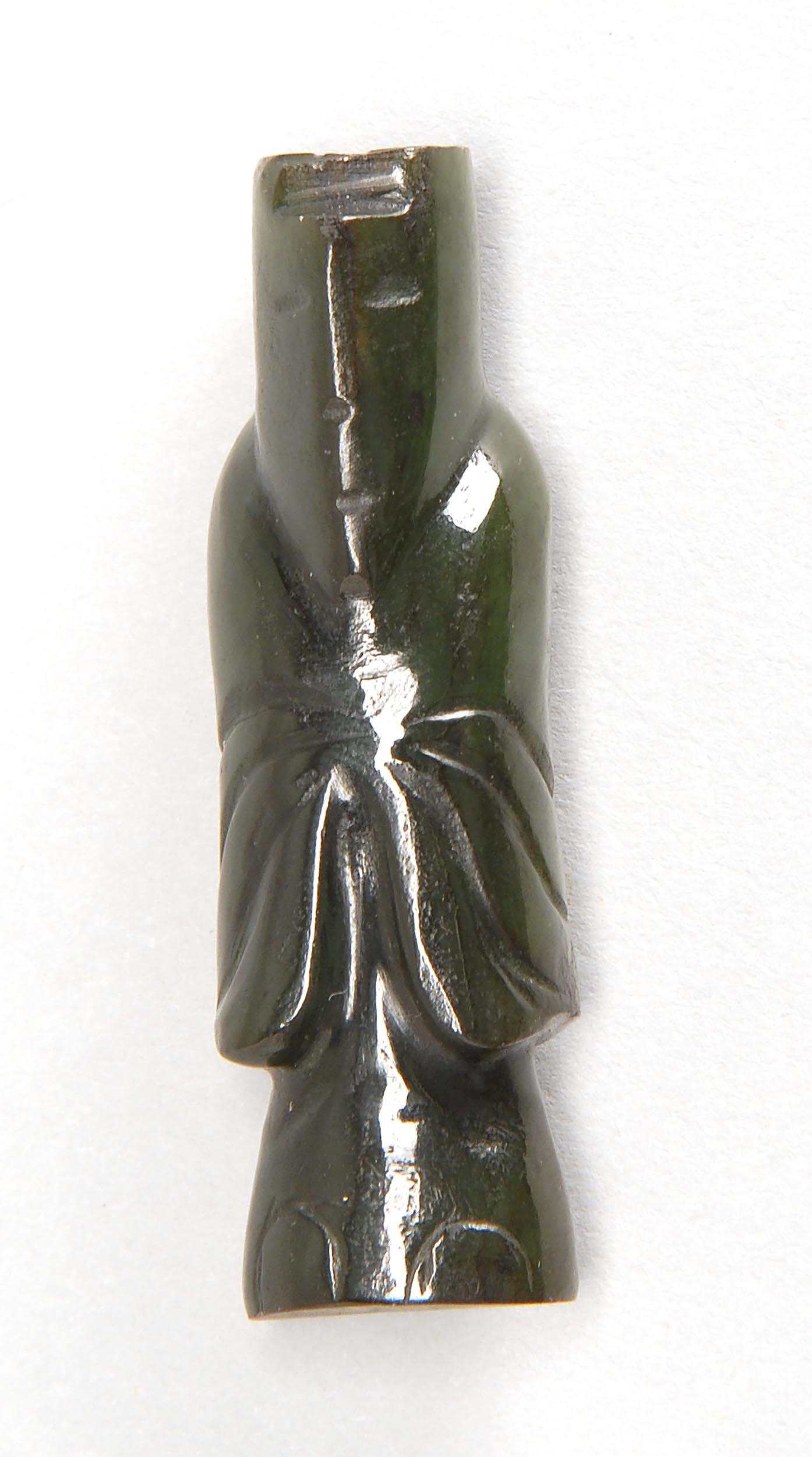 Appraisal: GREEN JADE FIGURE Han StyleIn the form of a standing