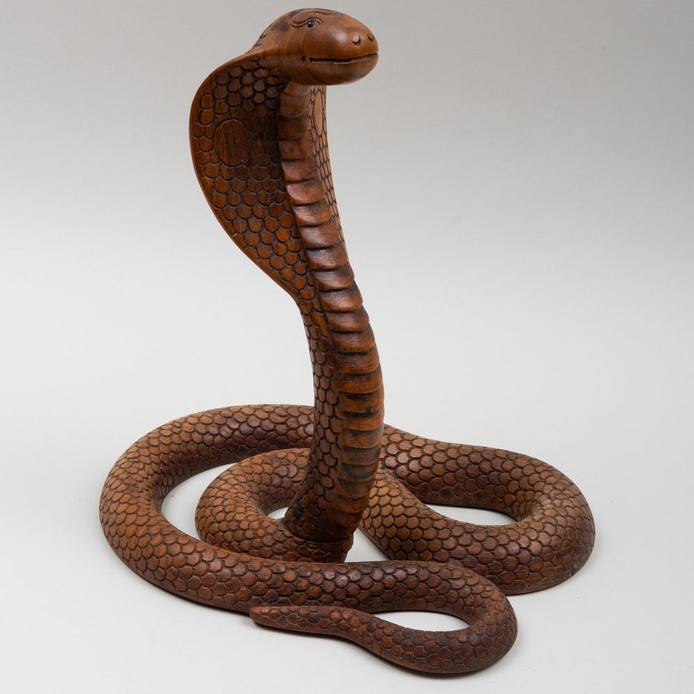 Appraisal: Carved Wood Model of a Coiled Cobra Inset with glass