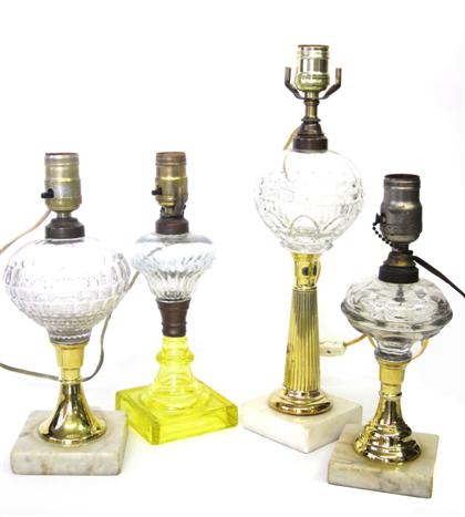 Appraisal: Four glass and brass fluid table lamps early th century