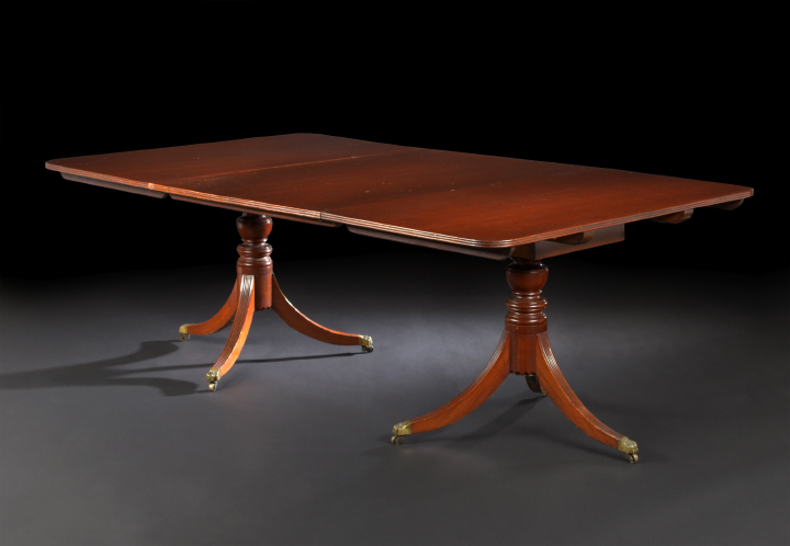 Appraisal: George III-Style Mahogany Dining Table the rounded rectangular top with