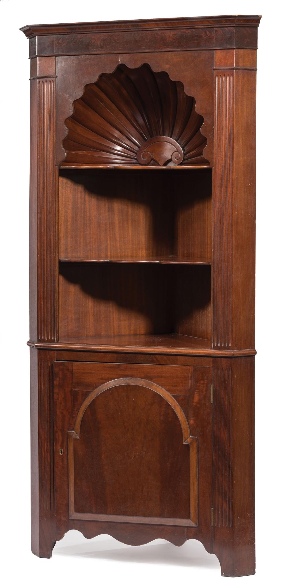 Appraisal: Carved Mahogany Corner Cabinet molded cornice carved shell over three