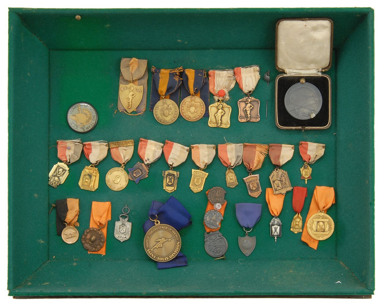 Appraisal: CASED DISPLAY OF TWENTY-SEVEN FENCING MEDALS In bronze sterling silver