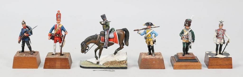 Appraisal: hand painted toy soldier figures metal on wooden bases all