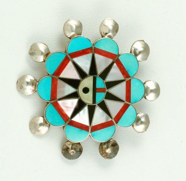 Appraisal: A sterling silver pin with inset stones of abalone jasper