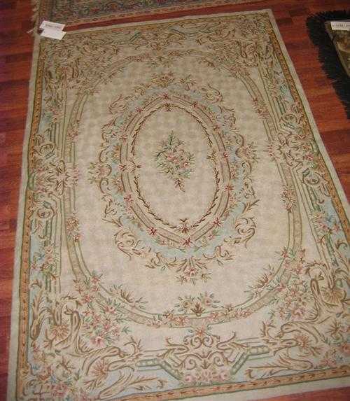 Appraisal: LOTZWILER old Beige ground with a floral central medallion the