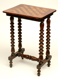 Appraisal: A VICTORIAN WALNUT GAMES TABLE Raised on a barley twist