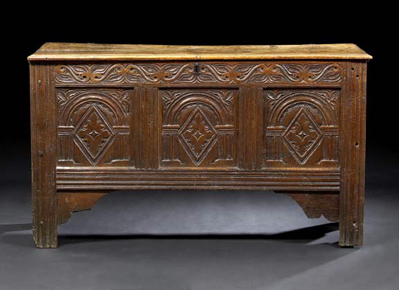 Appraisal: Continental Carved Oak Coffer th century the planked top hinged