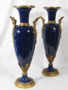 Appraisal: A pair of ormolu mounted cobalt blue porcelain vases marked