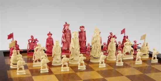 Appraisal: A th century Chinese carved and red stained ivory chess