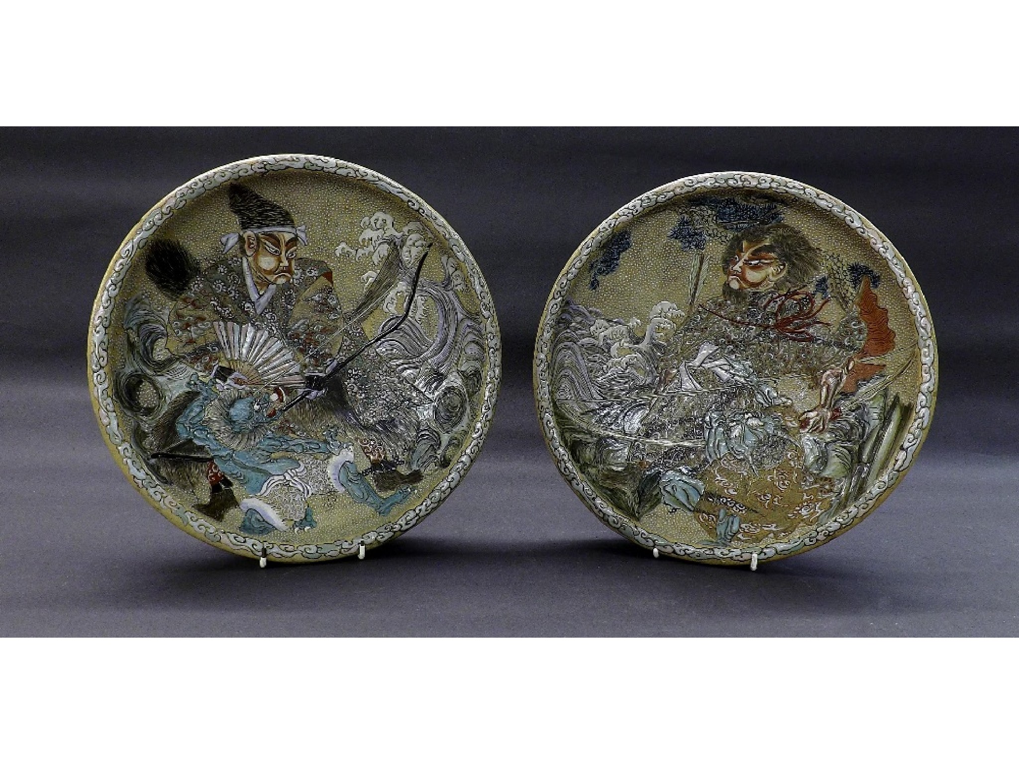 Appraisal: Pair of decorative Oriental earthenware chargers decorated in the Satsuma