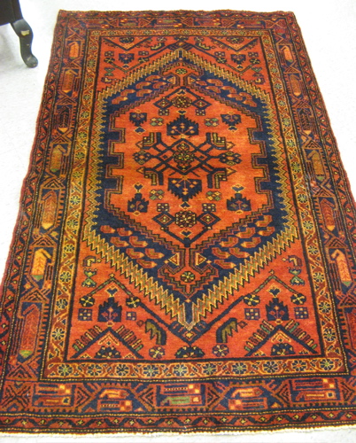 Appraisal: PERSIAN HAMADAN TRIBAL AREA RUG centering a large hexagonal reserve