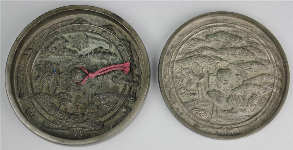 Appraisal: TWO JAPANESE SILVERED BRONZE MIRRORS PROBABLY EDO PERIOD the first