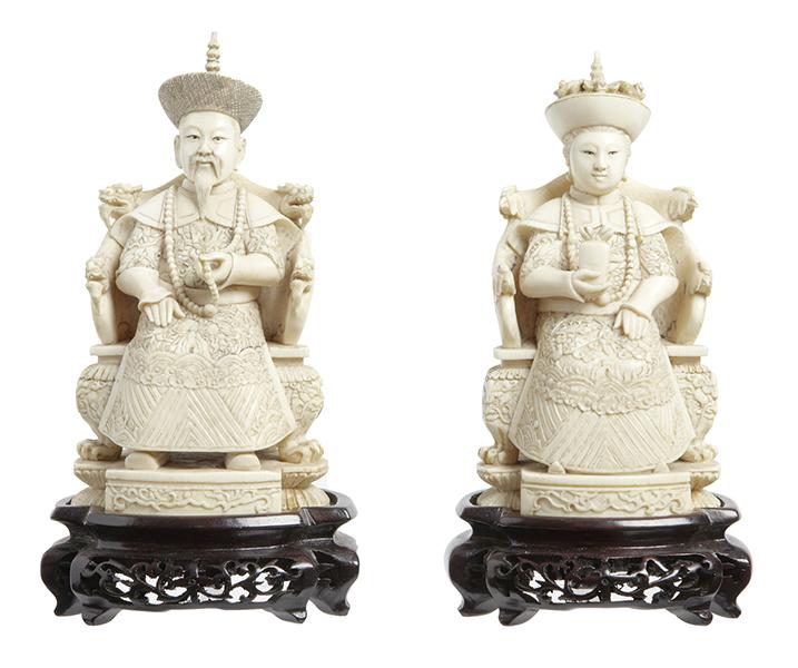 Appraisal: A CHINESE IVORY MANDARIN OFFICIAL AND HIS CONSORT SEATED ON