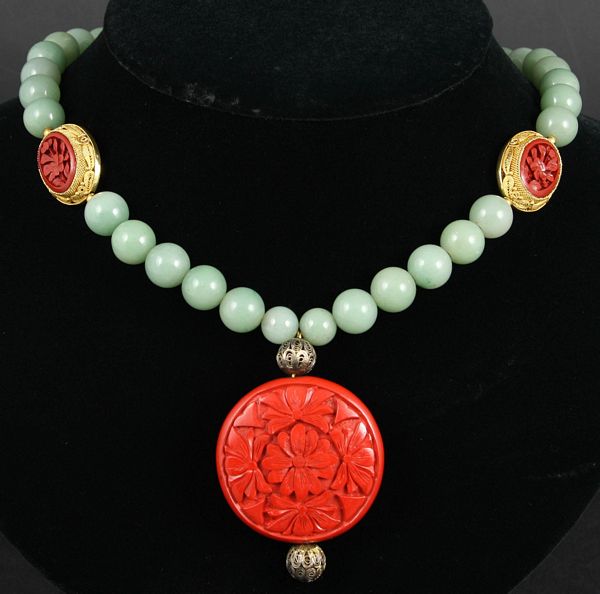 Appraisal: s Chinese jade cinnabar and silver with gold vermeil necklace