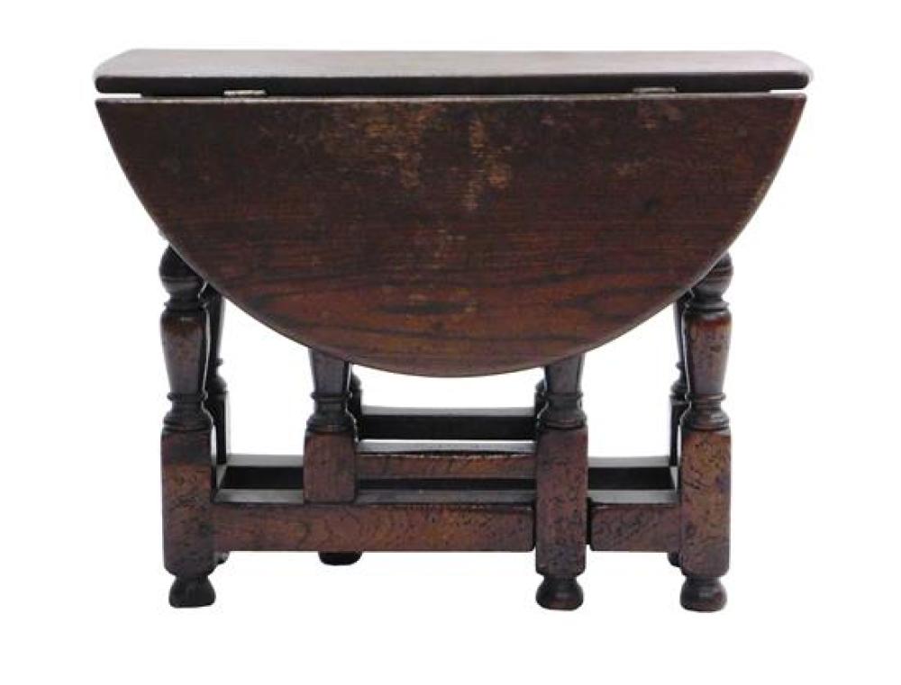 Appraisal: Diminutive Jacobean style gateleg table with early elements demilune leaves