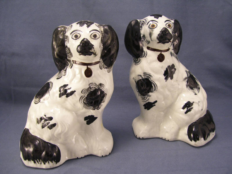 Appraisal: Pair Staffordshire Comforter Spaniels Black and white spaniels Measures high