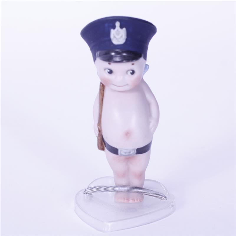 Appraisal: German Bisque Kewpie Doll in Policeman Outfit with bobby stick