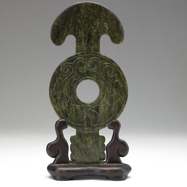 Appraisal: Carved disc in spinach jade on wood stand Carving x