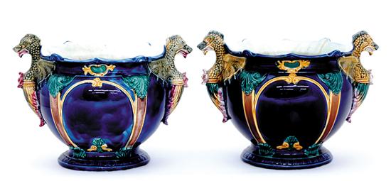 Appraisal: Pair majolica cachepots shaped rim on squat body flanked by