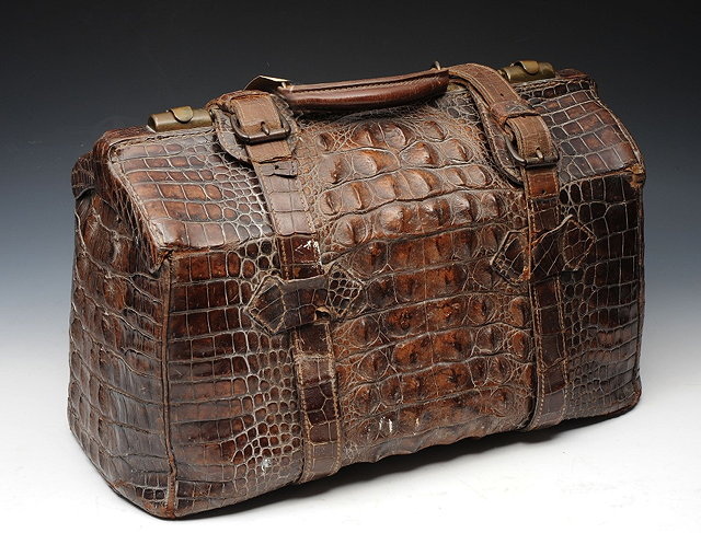 Appraisal: A CROCODILE SKIN LARGE GLADSTONE BAG and a tapestry seat