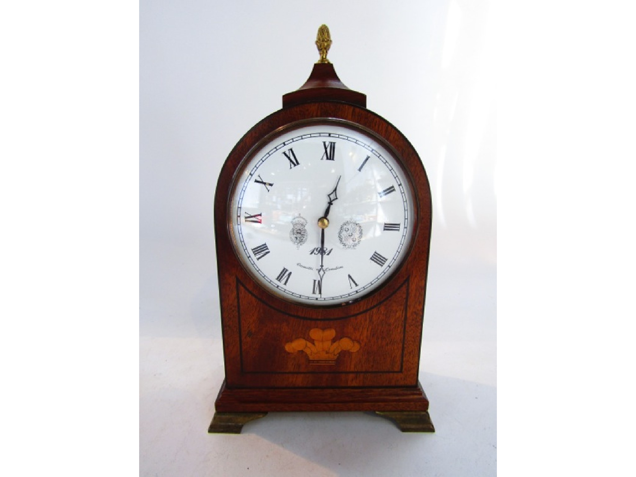 Appraisal: A Comitti Regency style mantel clock in a mahogany case