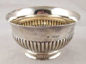 Appraisal: A Victorian silver bowl with half ribbed sides and everted