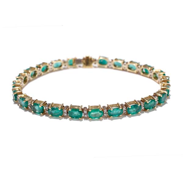 Appraisal: Gold K emerald and diamond line bracelet containing oval emeralds