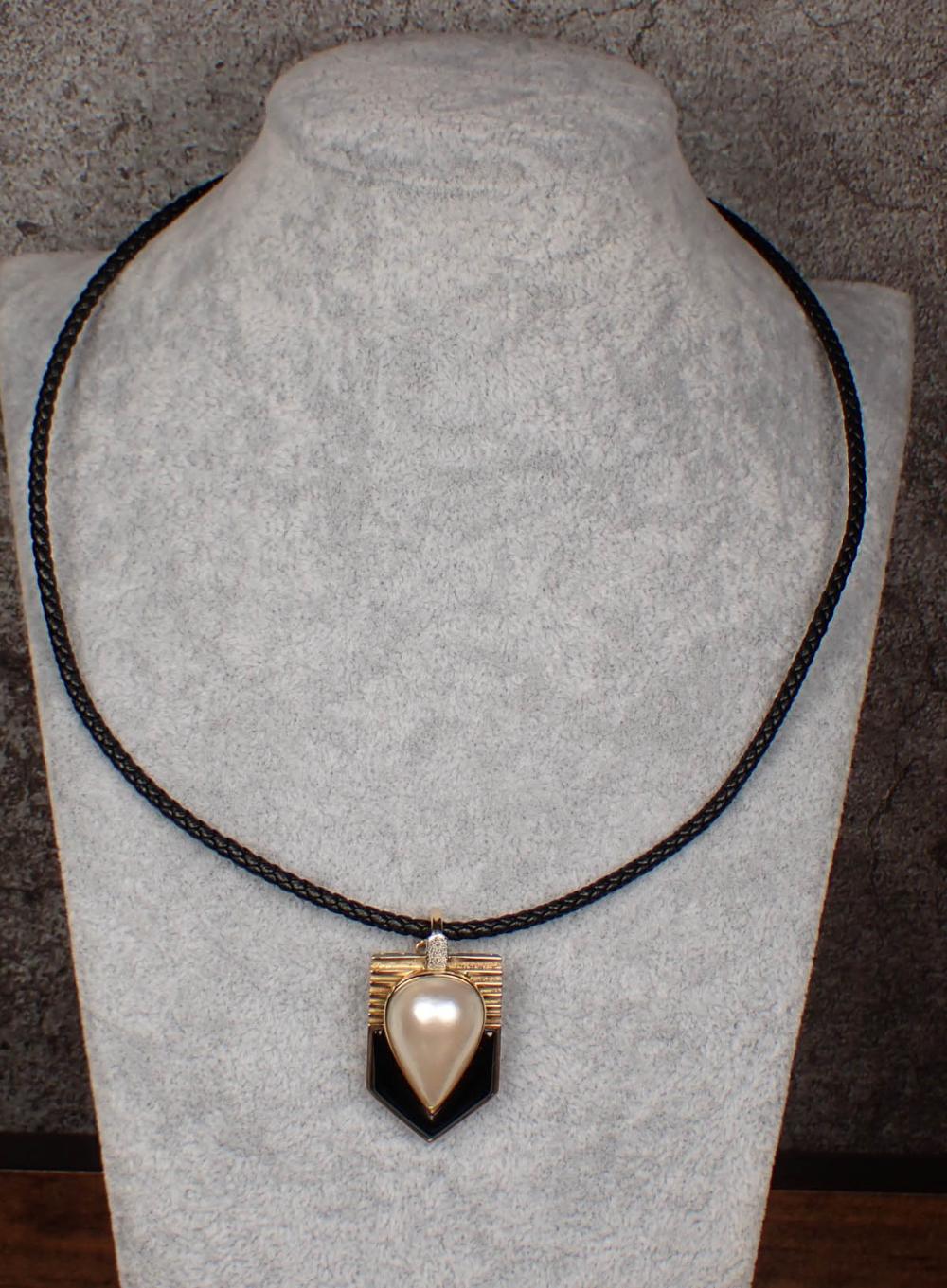 Appraisal: MABE PEARL AND BLACK ONYX PENDANT NECKLACE k yellow and