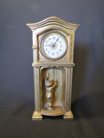 Appraisal: Art Deco Figural Clock bronzed case shaped as a grandfathe