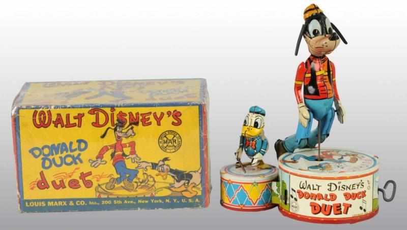 Appraisal: Tin Marx Disney Donald Duck Duet Wind-Up Toy Description American