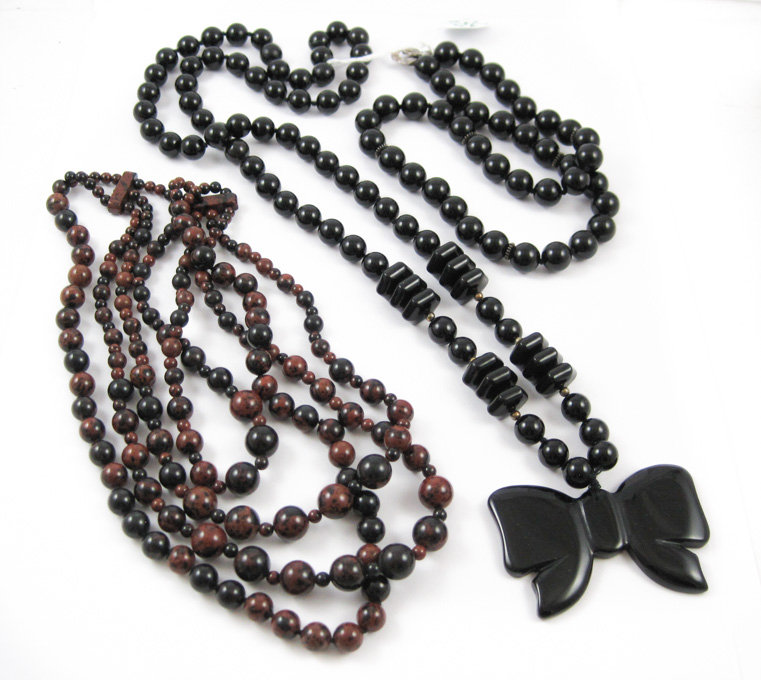 Appraisal: THREE BEAD NECKLACES including a - inch necklace strung with