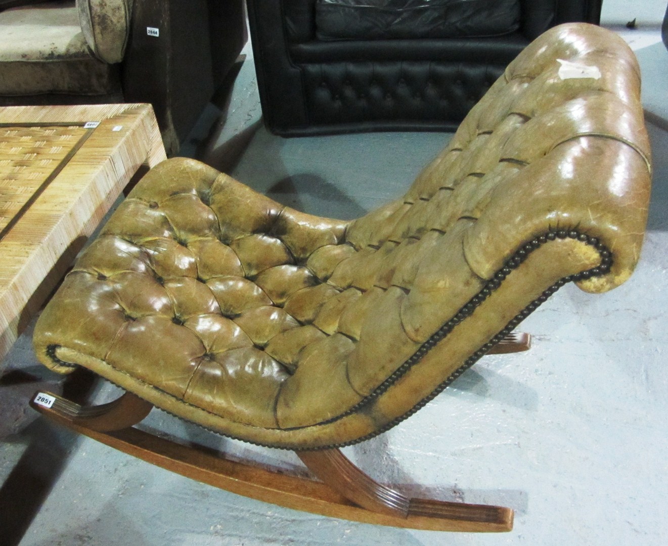 Appraisal: A mahogany and green leather buttoned rocking chair