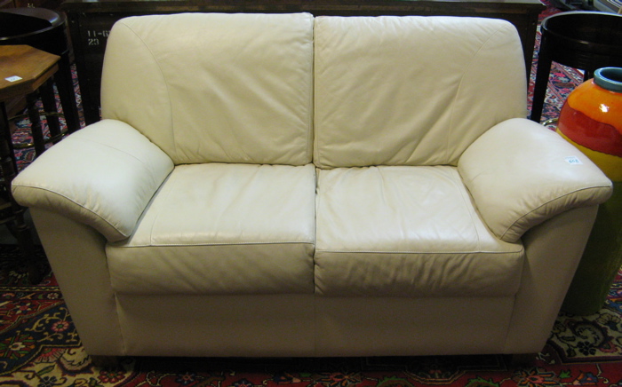 Appraisal: IVORY LEATHER LOVESEAT The Leather Furniture Co