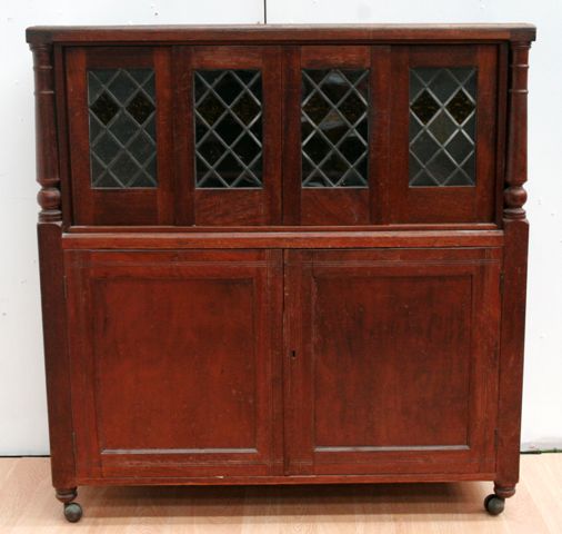 Appraisal: An early th century cedar drinks cabinet with leadlight glass