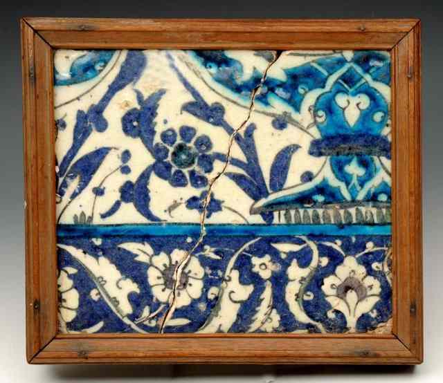 Appraisal: A DAMASCUS POLYCHROME GLAZED POTTERY TILE with trailing foliate th