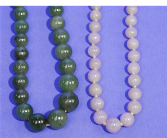 Appraisal: TWO JADE GRADUATED BEAD NECKLACES one green length inches the