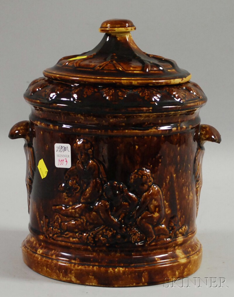 Appraisal: Large Rockingham Glazed Molded Pottery Jar with Cover ht in