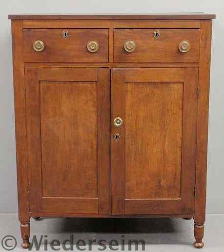 Appraisal: Walnut jelly cupboard c with two drawers over two doors