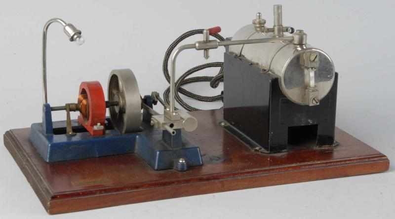 Appraisal: Jensen Live Steam Engine Toy on Platform Description Mounted on