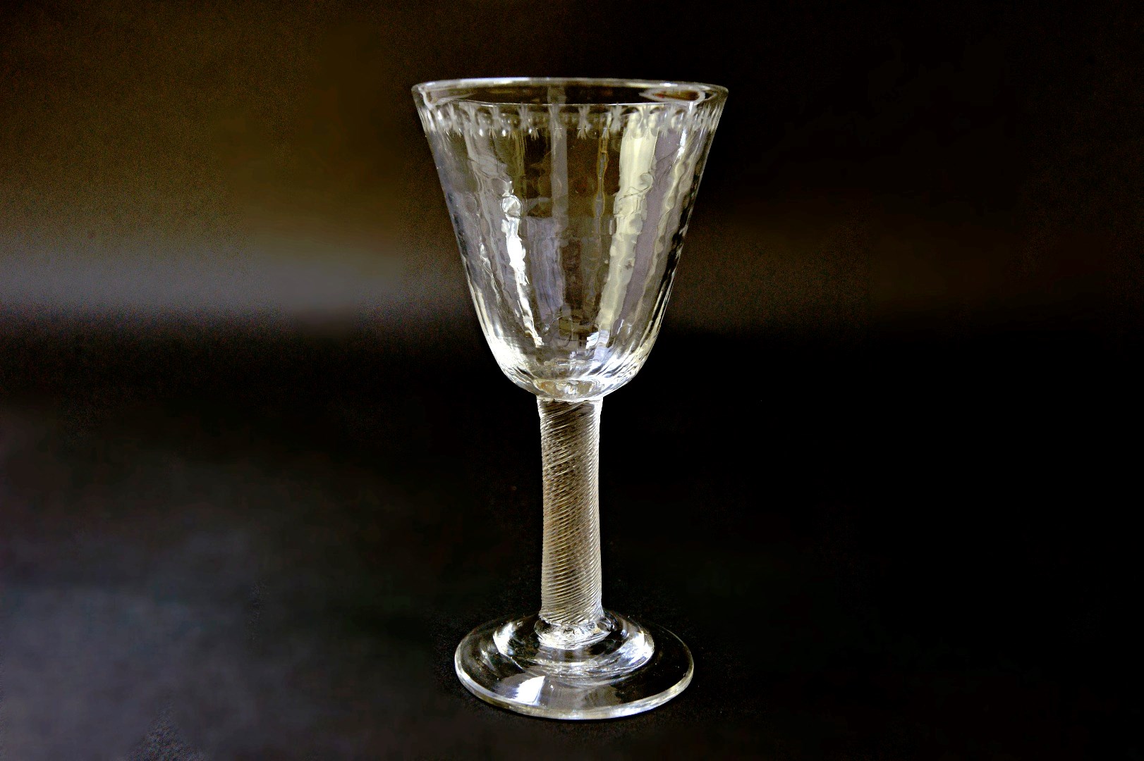 Appraisal: A mid th century wine glass with moulded bowl incised