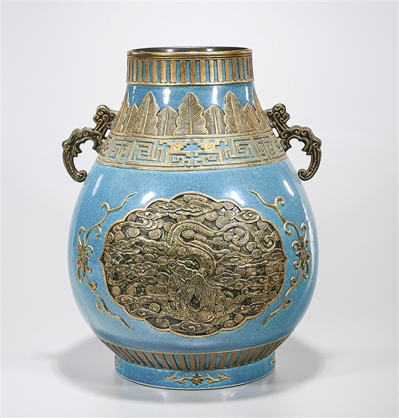 Appraisal: Chinese blue glazed porcelain vase with gilt mold relief design