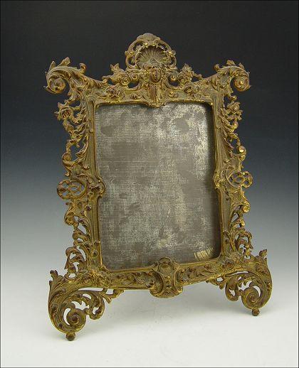 Appraisal: BRADLEY HUBBARD CAST IRON PETTICOAT MIRROR FRAME Foliate scroll with