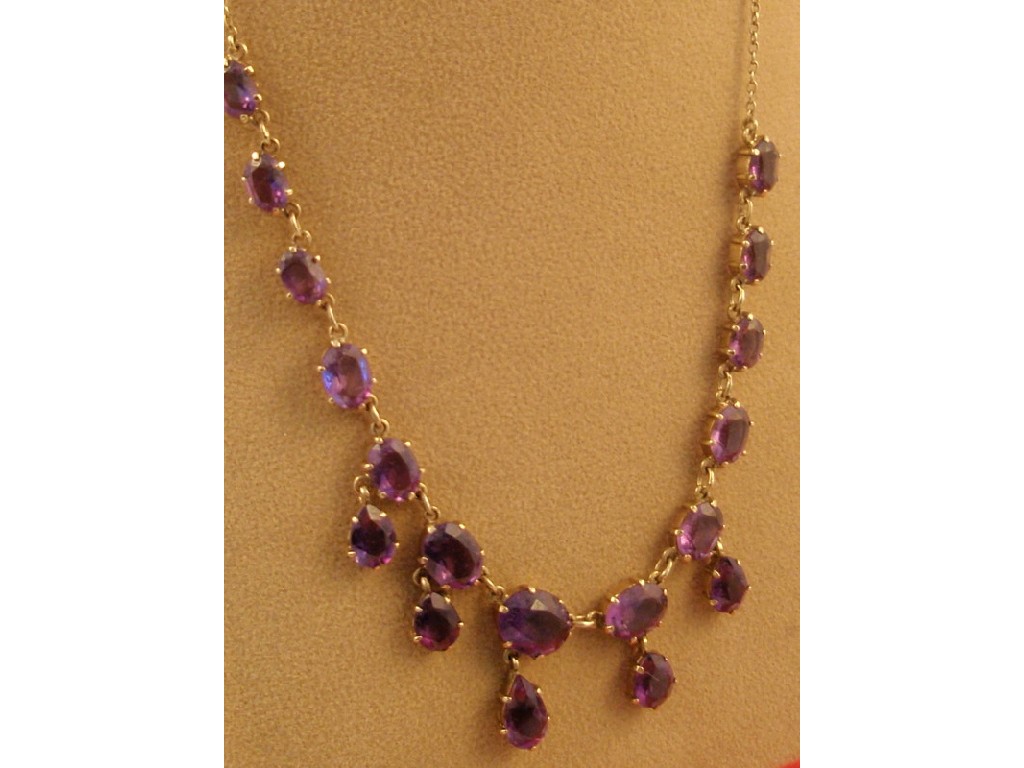 Appraisal: An amethyst set necklace with droppers all in yellow metal