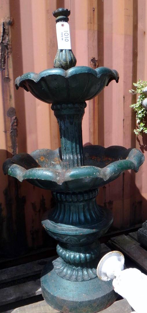 Appraisal: A green painted cast iron two tier water fountain on