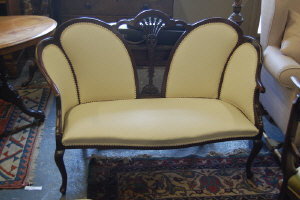 Appraisal: A Victorian style mahogany framed upholstered two seater salon sofa