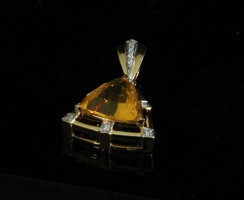 Appraisal: A yellow quartz and diamond pendant the sapphire of triangular