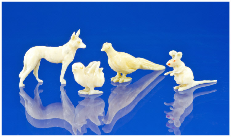 Appraisal: Four Carved Bone Miniatures Modelled As A Mouse Chick Dog