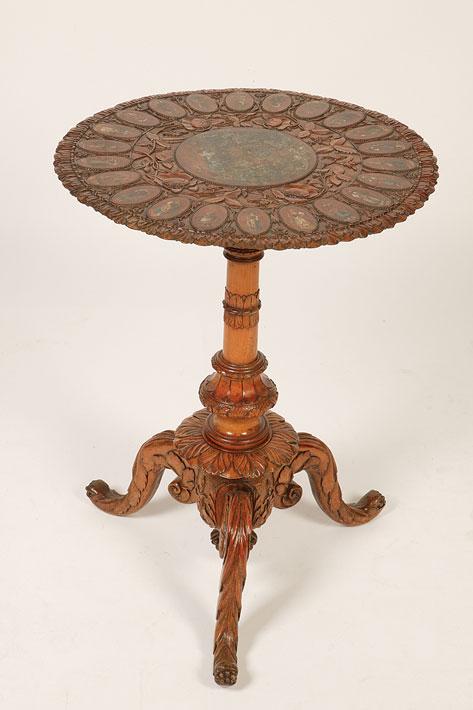 Appraisal: AN OLIVE WOOD SERENTO WARE TABLE the circular carved top